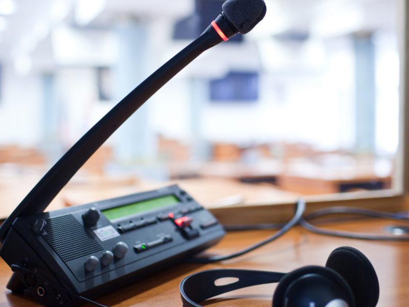 interpreting - Microphone and switchboard in an simultaneous interpreter booth